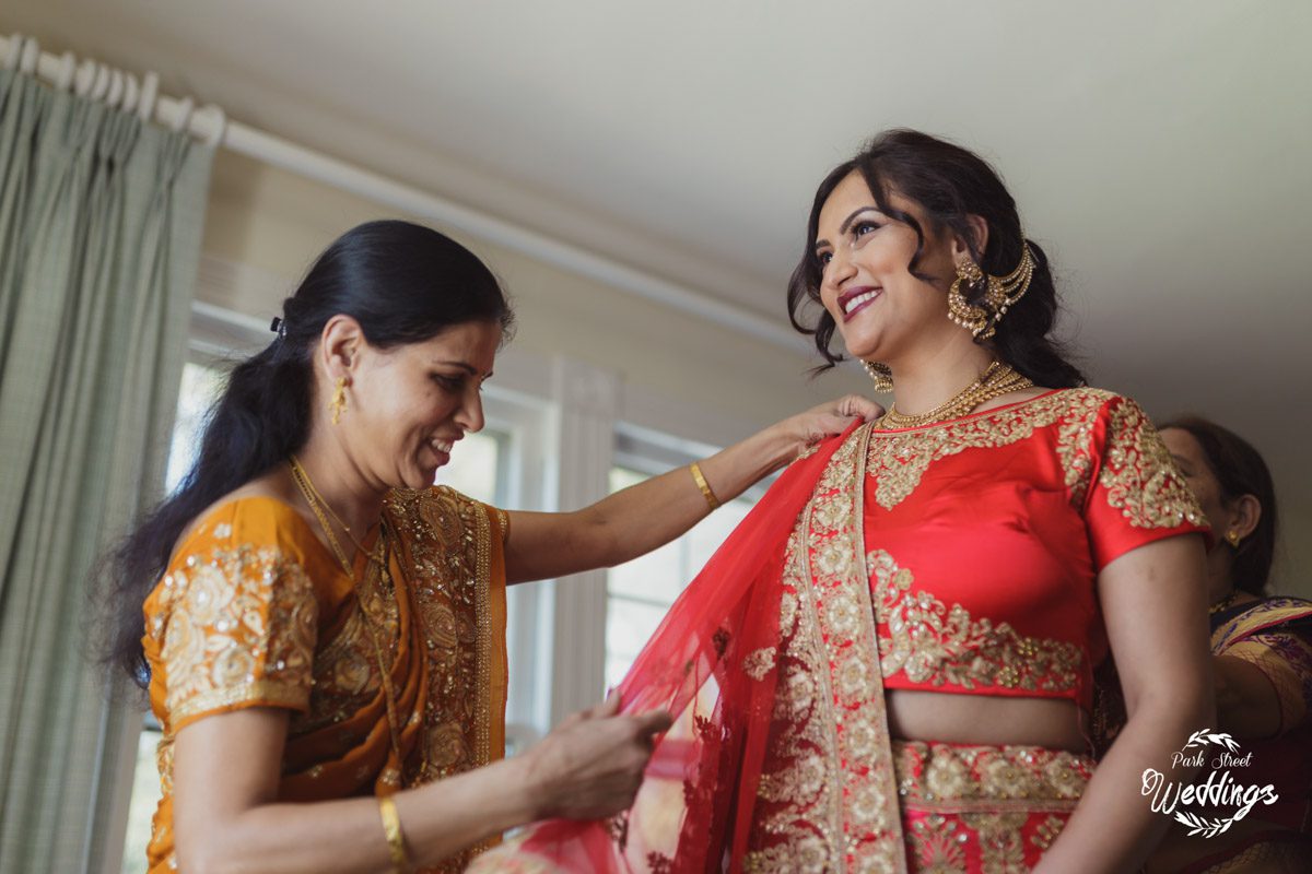 mom-helping-bride-with-brightly-colored-indian-reception-attire-danbury-ct