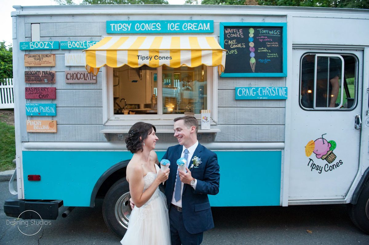 couple-in-front-of-dessert-truck-with-tipsy-cones-july-reception