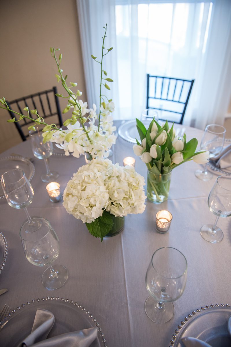 Silver and Spring White with silver filigree votive make a simple table setting look elegant.