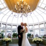 couple kissing in conservatory